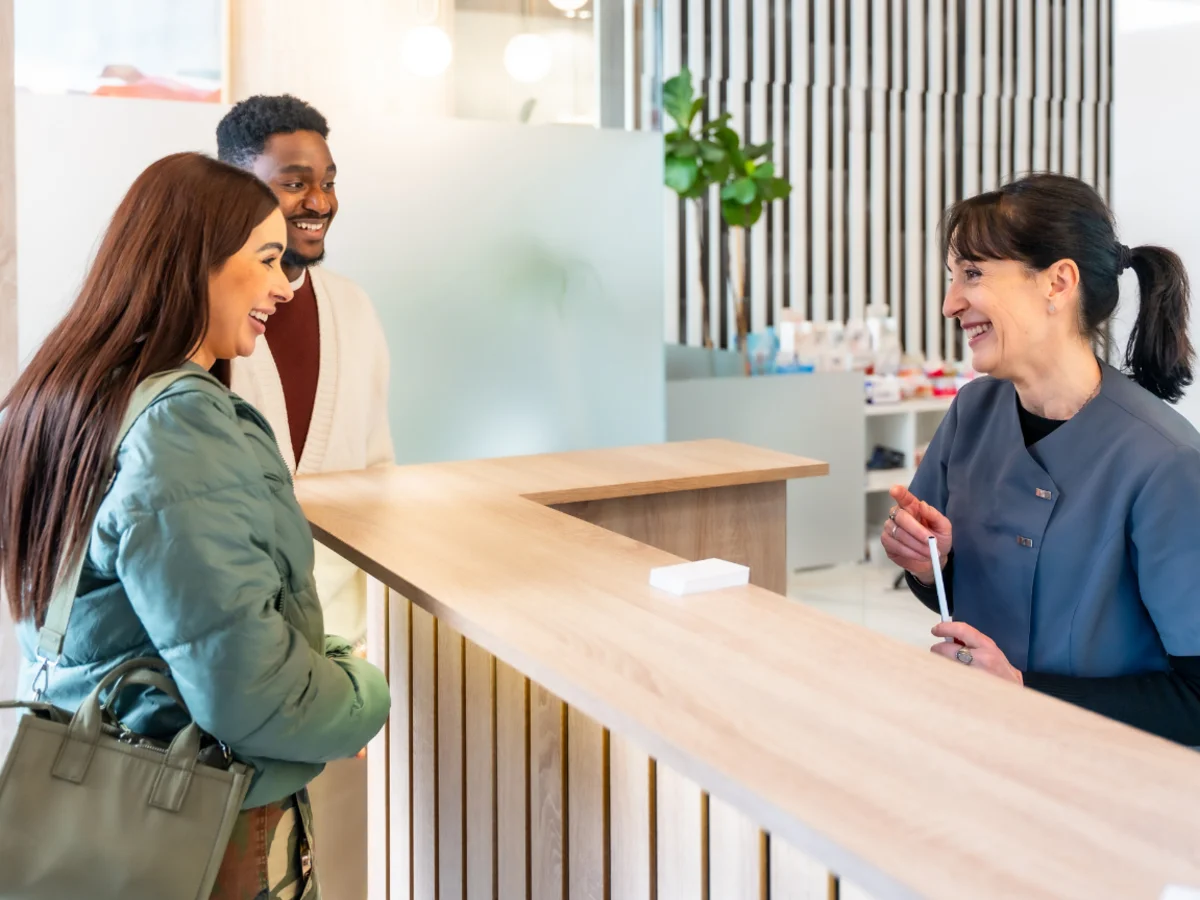 Patient checking in at a healthcare reception desk